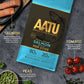 AATU salmon dry dog food with it's blue packaging is laying flat on a dark surface. Around it lay images of the fresh ingredients that it cotains with it's benefits next to it. Salmon fillets are in the top left hand corner stating that it is rich in Omega 3 and Omega 6 and that it supports a strong immune system as well as enhances skin and coat. Fresh tomatos lay in the bottom right hand corner stating high in Vitamin C, Carotenoids and beta-carotene. Then lastly in the bottom left hand corner are peas.