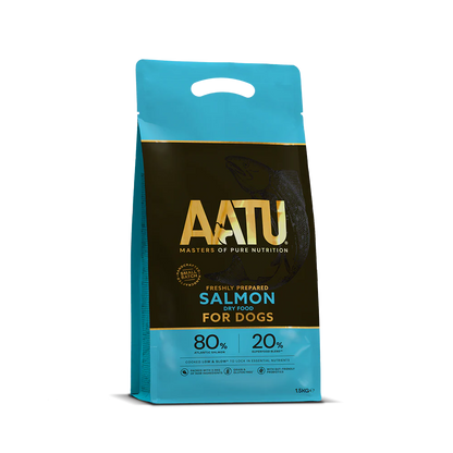 There is a bag of AATU Salmon Dry Dog Food. It is a front view of the packaging and the bag is blue with a dark band in the middle. The wording AATU is embellished in gold font on the front of the bag with the tag line 'Masters of pure nutrition'. The bag has a little handle at the top and it is marked as a 1.5kg bag.
