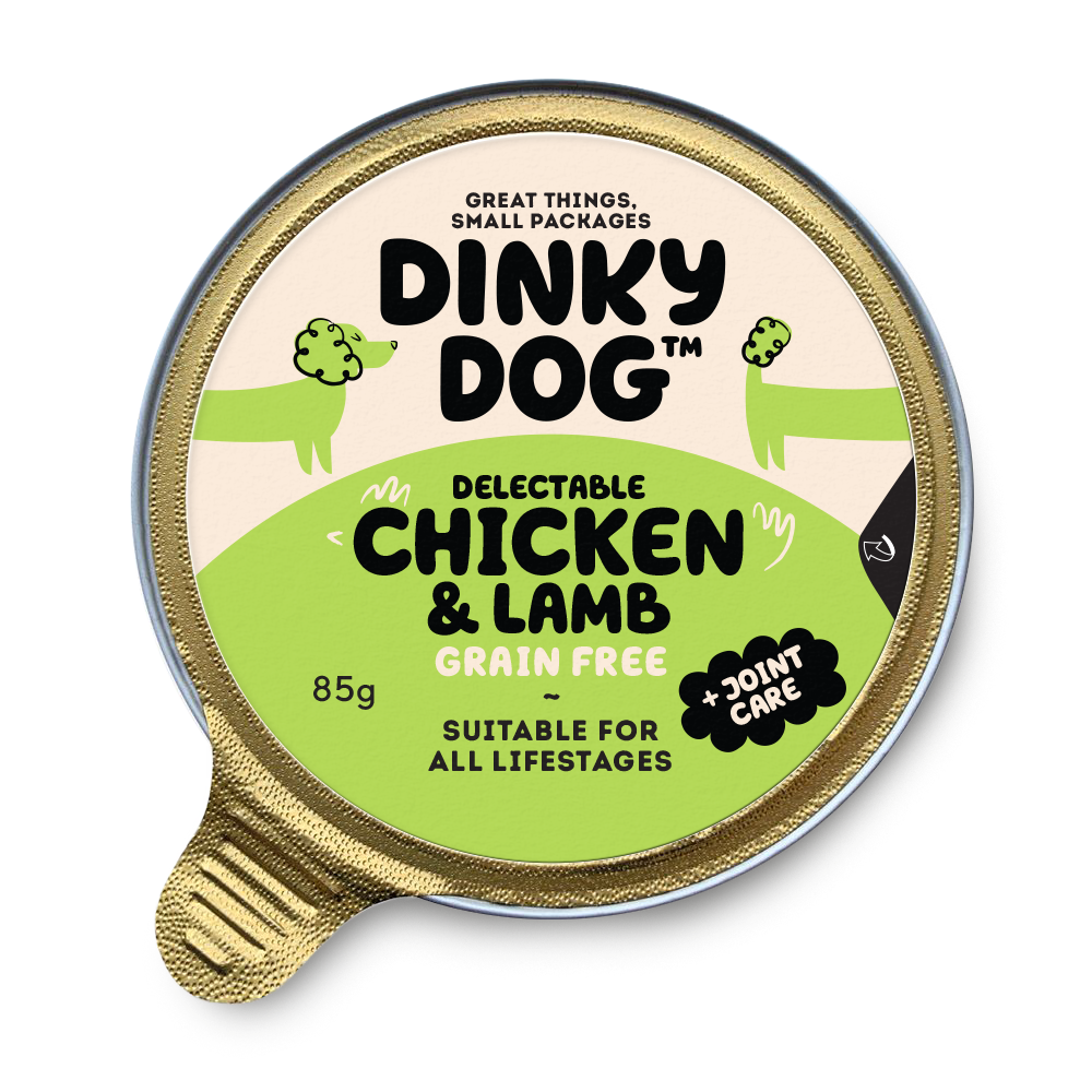 Dinky Dog Chicken & Lamb 85g wet dog food in a sealed gold tray with green label, grain-free and suitable for all life stages.