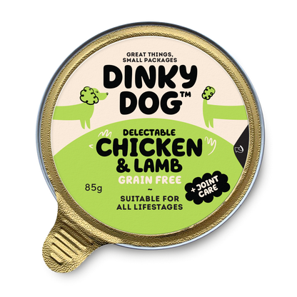 Dinky Dog Chicken & Lamb 85g wet dog food in a sealed gold tray with green label, grain-free and suitable for all life stages.