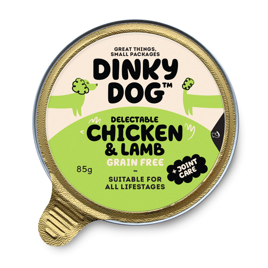 Dinky Dog Chicken & Lamb 85g wet dog food in a sealed gold tray with green label, grain-free and suitable for all life stages.
