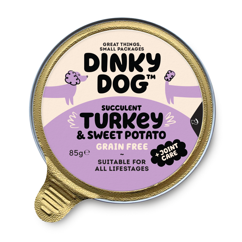 Dinky Dog Turkey & Sweet Potato 85g wet dog food in a gold-lidded container, labeled grain-free and suitable for all life stages with joint care.